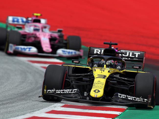 Lance Stroll in his pink Racing Point hunted Ricciardo in Austria.