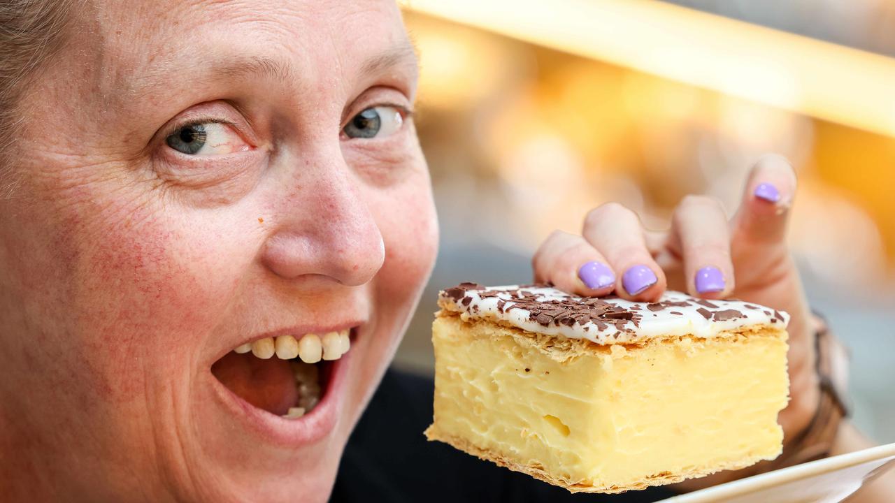 Bake Bakery manager Cass Barlow with a vanilla slice. Picture: Russell Millard