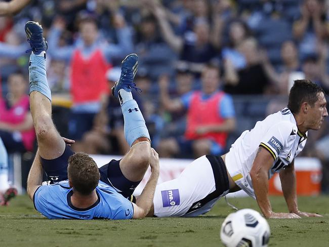 SYDNEY, AUSTRALIA - JANUARY 30: Mark Milligan of Macarthur FC  tackles Trent Buhagiar of Sydney FC before being given a red card during the A-League match between Macarthur FC and Sydney FC at Campbelltown Stadium, on January 30, 2021, in Sydney, Australia. (Photo by Ryan Pierse/Getty Images)