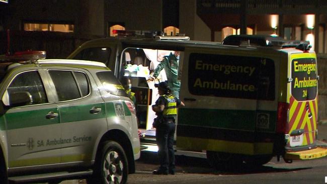 Paramedics at the scene of the stabbing. Huckleberry Myers, 9 and his mother, Holly were attacked and robbed while in their car on Sunday morning. Picture: 7NEWS