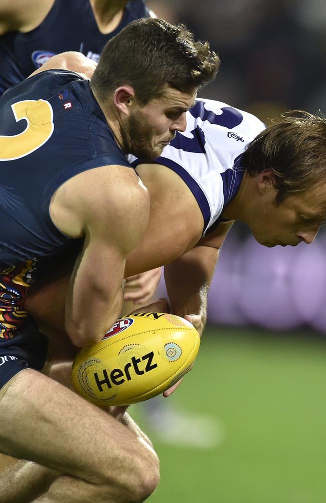 Brad Crouch  tackles Cameron Sutcliffe of the Dockers at Adelaide Oval. Picture: David Mariuz (AAP)