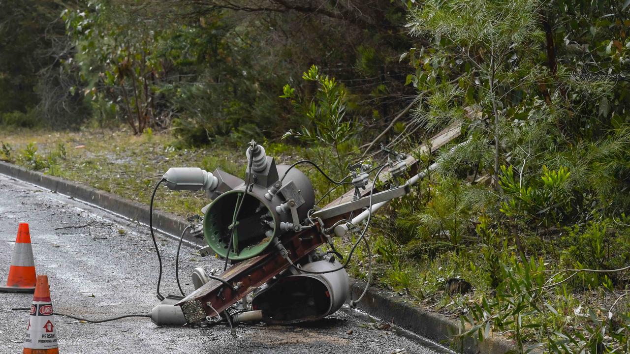 A felled Stobie pole in Hilltop Drive at Upper Sturt on Tuesday. Picture: Roy VanDerVegt