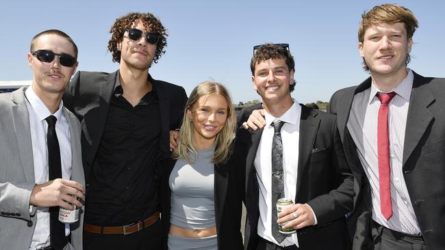 Caulfield Guineas horse race meeting, Caulfield, Victoria, Saturday 12th October 2024. Faces in the crowd. Pictured enjoying the race meeting are Jack, Isaac, Sienna, Ash and James. Picture: Andrew Batsch