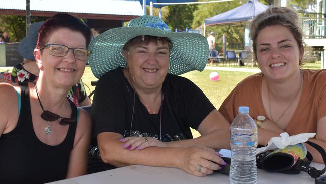 Lindsey Thorpe, Sherry Dell and Ebonie Vellacott staying cool in the shade on Australia Day.