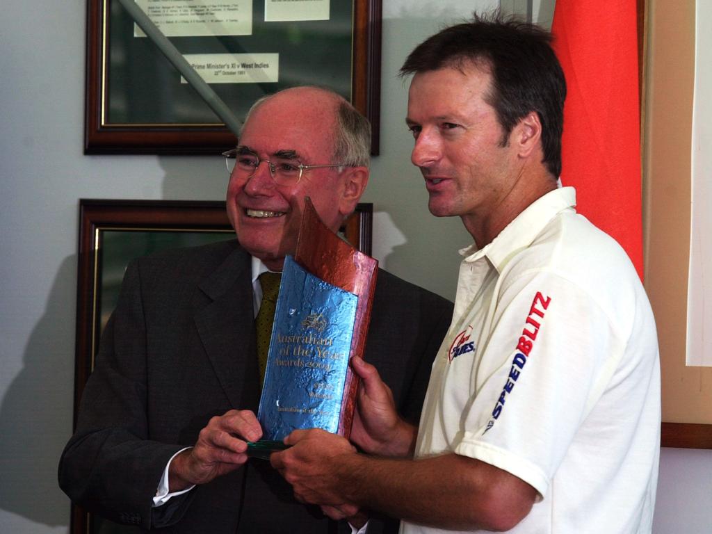 A ‘very good Australian of the Year’ … Steve Waugh receives his award from then-Prime Minister John Howard.