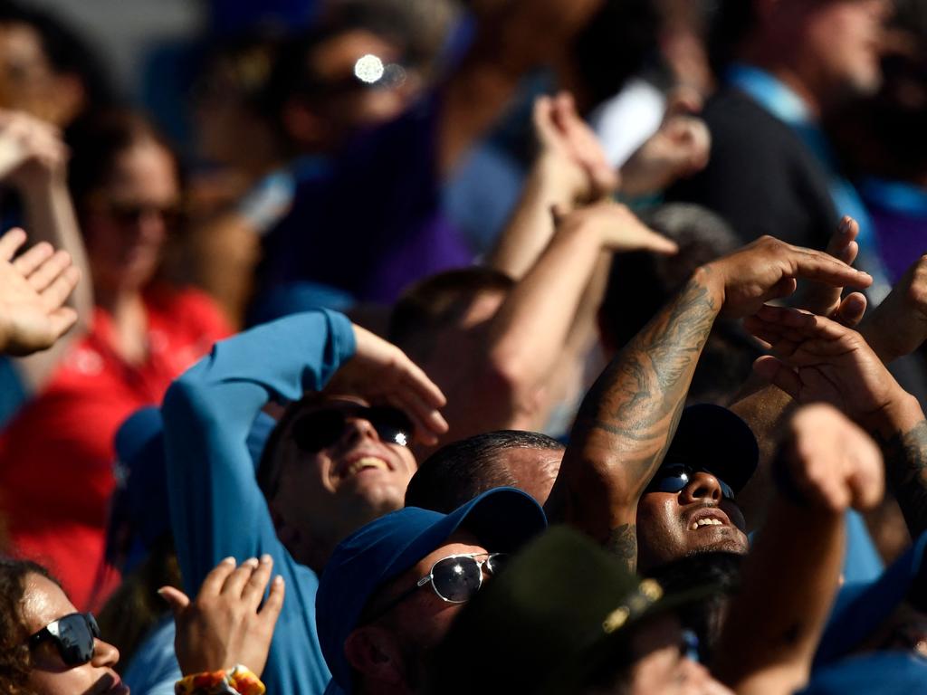 Spectators watch as the Virgin Galactic SpaceShipTwo space plane Unity and mothership separate, as they fly way above Spaceport America. Picture: AFP