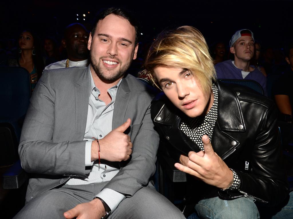 Bieber with his longtime manager Scooter Braun in 2015. Picture: Kevin Mazur/MTV1415/WireImage