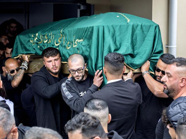 Abdulrahim’s coffin is carried from the mosque after the service. Picture: David Geraghty