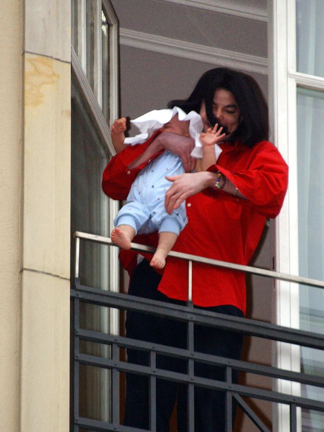 Jackson held his son 8-month-old son Prince Michael II over the balcony of his Berlin hotel room in 2002. Picture: Olaf Selchow/Getty Images