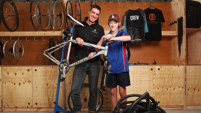Ant Edler Director Tasmanian Bike Collective with RJ Cotterill 12 in grade 7 at Bayview Secondary College who is a participant in the program. Launch of Tasmanian Bike Collective at Clarence Plains aiming to work with young people in the area offering mentoring through the restoration and selling of donated bikes while developing important life and work skills. Picture: Nikki Davis-Jones