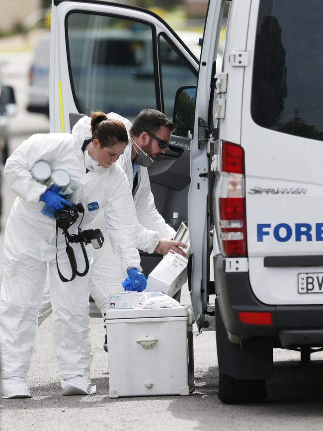 Forensic officers at the scene of