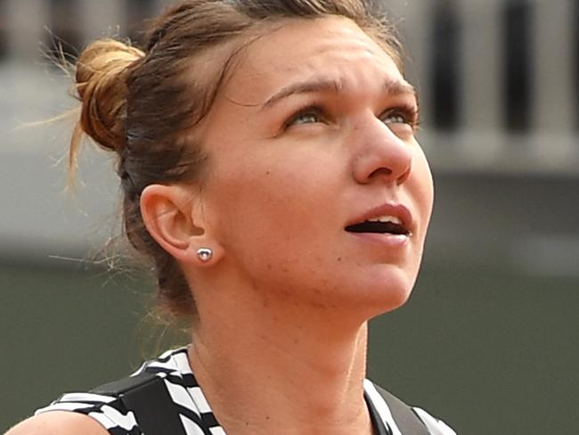 PARIS, FRANCE - MAY 23: Simona Halep of Romania reacts during the Women's Singles first round match against Nao Hibino of Japan on day two of the 2016 French Open at Roland Garros on May 23, 2016 in Paris, France. (Photo by Dennis Grombkowski/Getty Images)