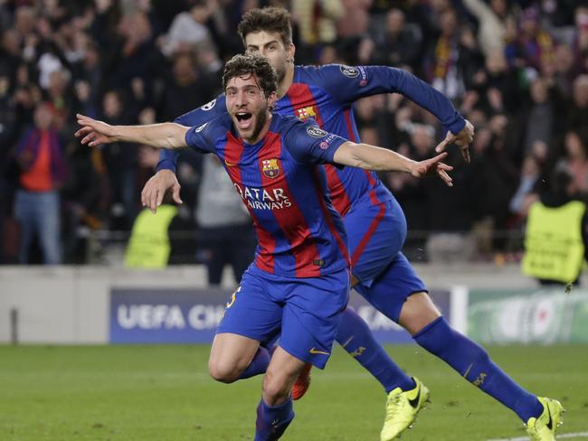 Barcelona's Sergi Roberto celebrates after scoring the sixth goal during the Champion League round of 16, second leg soccer match between FC Barcelona and Paris Saint Germain at the Camp Nou stadium in Barcelona, Spain, Wednesday March 8, 2017. Barcelona won 6-1. (AP Photo/Emilio Morenatti)