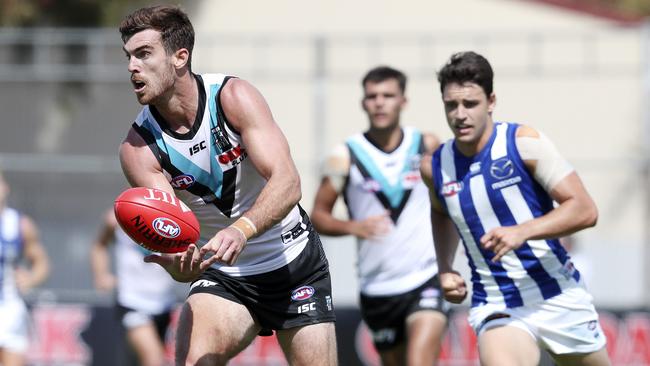 Scott Lycett in action at Alberton Oval on Saturday.