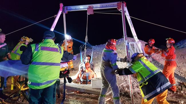 SES and CFS volunteers work to rescue the man. Picture: South Australia Police