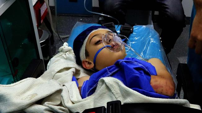 An injured Jordanian boy in hospital yesterday. Picture: AFP