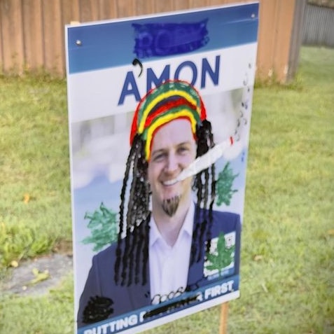 A campaign poster for the Liberal candidate for Pittwater, Rory Amon, was painted by an unknown artists depicting him as a Rastafarian with a liking for a certain vegetable matter. Picture: Facebook