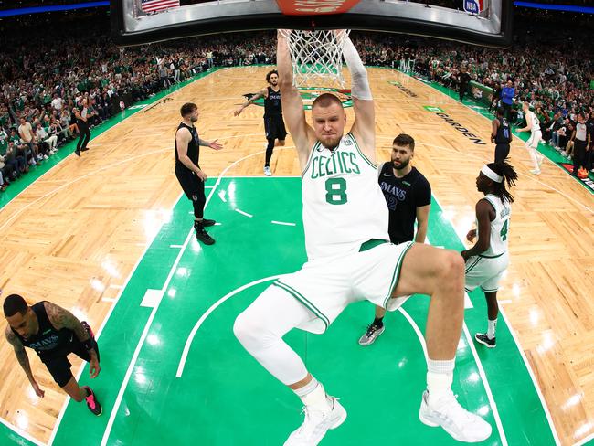 BOSTON, MASSACHUSETTS - JUNE 06: Kristaps Porzingis #8 of the Boston Celtics dunks the ball during the first quarter against the Dallas Mavericks in Game One of the 2024 NBA Finals at TD Garden on June 06, 2024 in Boston, Massachusetts. NOTE TO USER: User expressly acknowledges and agrees that, by downloading and or using this photograph, User is consenting to the terms and conditions of the Getty Images License Agreement. (Photo by Maddie Meyer/Getty Images)