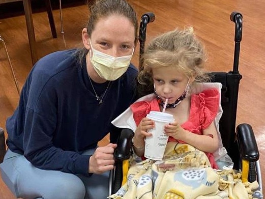 Clare Miln with her daughter Isla, 3, who broke both legs and her pelvis when hit by the runaway snow blower in the United States. Picture: Supplied (GoFundMe).