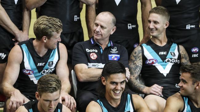 AFL - Port Adelaide Photo Day at Alberton Oval. Ken Hinkley talking to his captain Tom Jonas with vice captain Hamish Hartlett on the right Picture SARAH REED