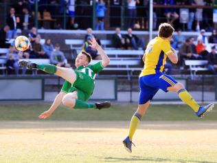 August 22, Ashmore Village Park, Ashmore, Gold Coast, Queensland. Southport striker Elliot Middleton attempts a mid air bicycle kick during action from the Gold Coast premier league match between Southport and Broadbeach United.Scott Powick Newscorp