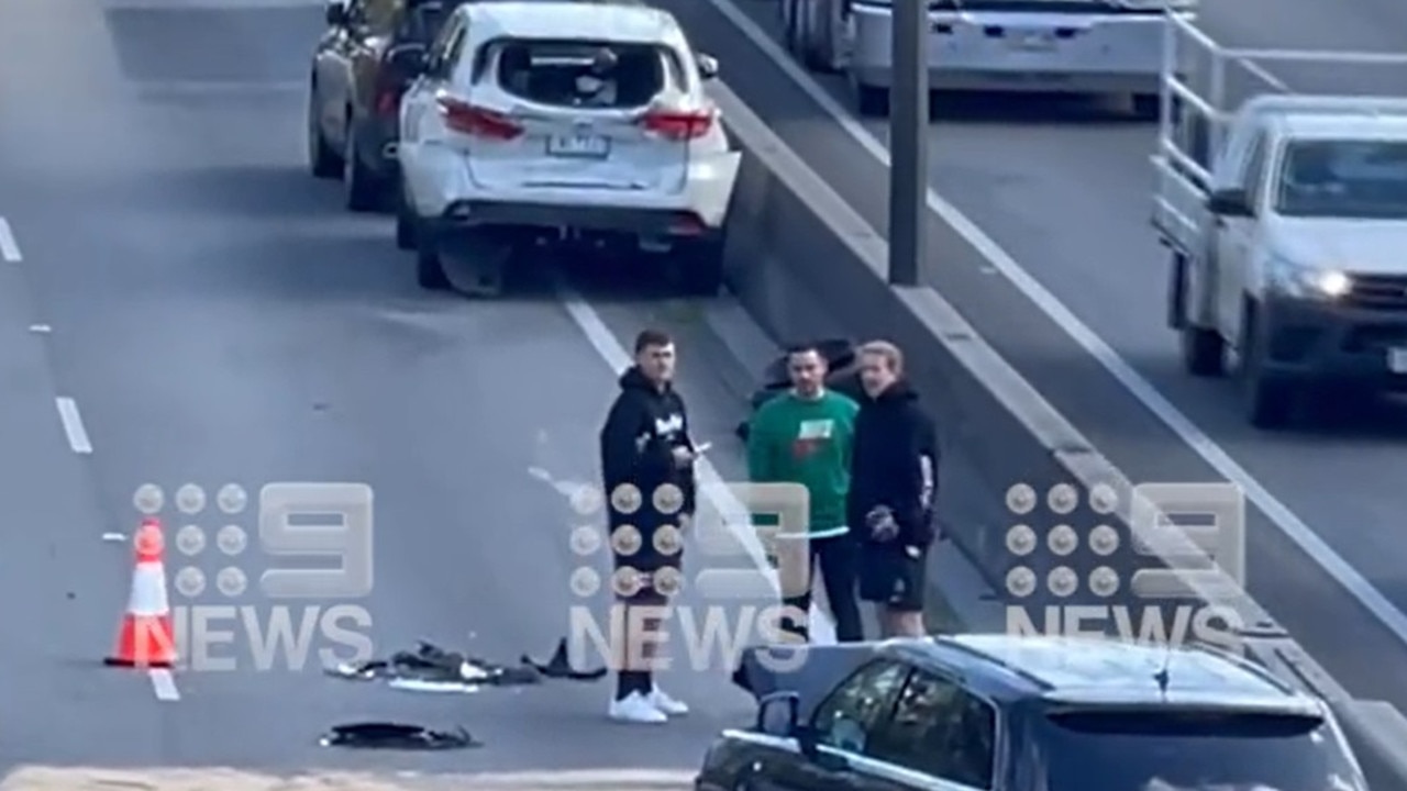 Two Collingwood players seen on the Monash Freeway. Photo/l Twitter: @9NewsMelb.