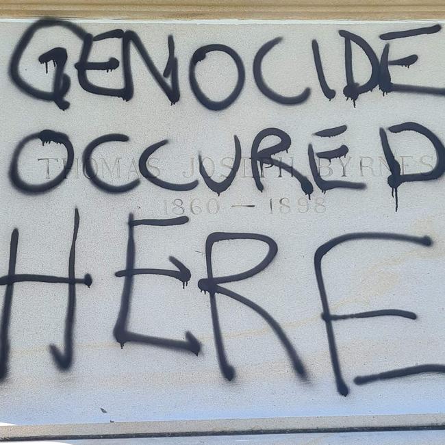 Vandals scrawled “Genocide occurred here” over the statue of Thomas Joseph Byrnes. Picture: Supplied