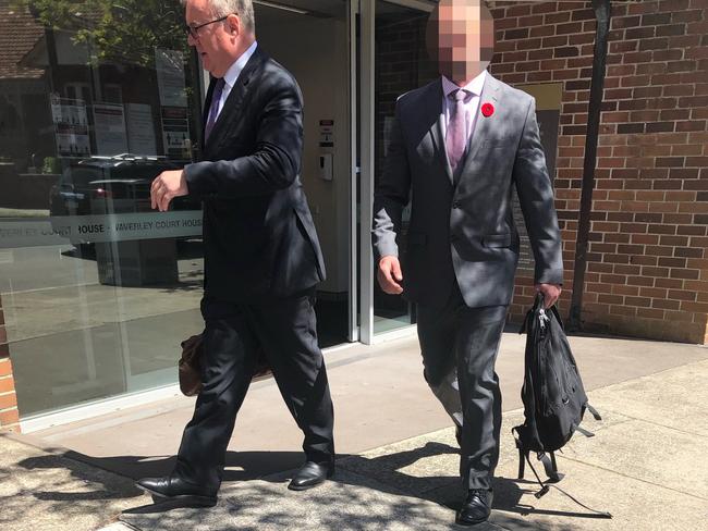 The soldier (right) leaves Waverley Local Court accompanied by his Australian Defence Force lawyer.