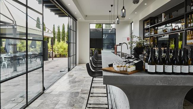 Marble and concrete dominate the slick Pietro Gallus Estate grappa bar. Picture: Parker Blain