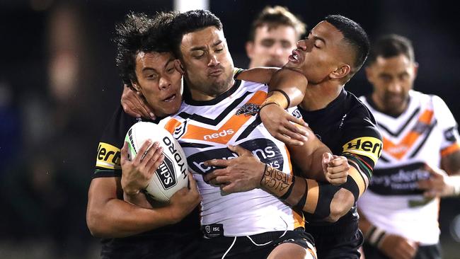 David Nofoaluma is crunched by the Panthers defence.