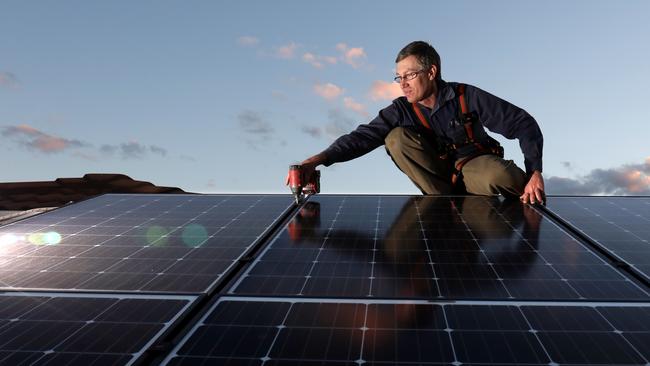 Solar panels are installed a roof. The State Government is planning to begin rolling out batteries for home solar systems to protect against blackouts. Picture: James Croucher