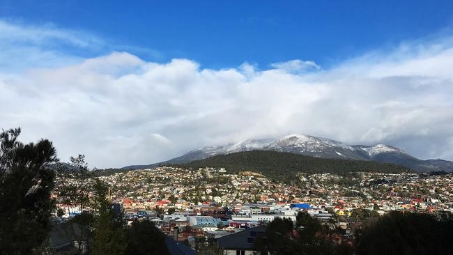 A snow-capped Mt Wellington/kunanyi backed by beautiful blue skies over Hobart last week. Picture: RICHARD JUPE