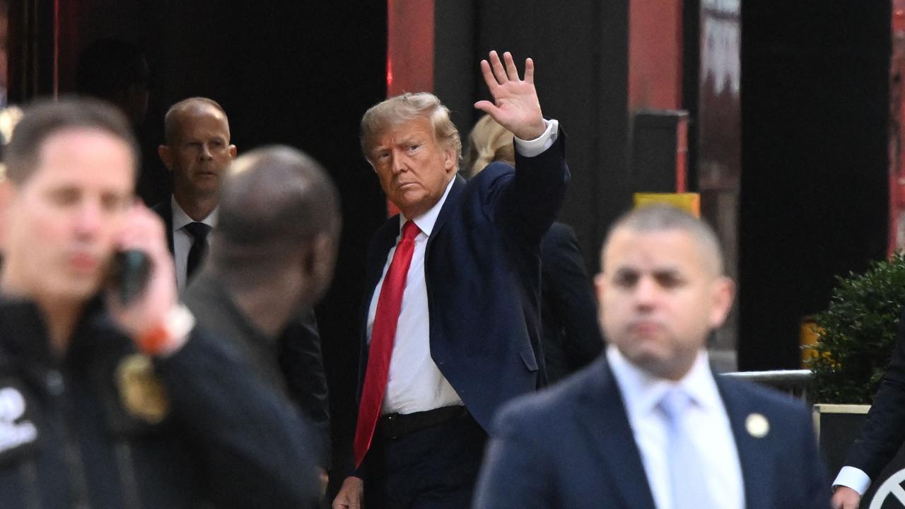 Former US President Donald Trump waves as he arrives at Trump Tower in Manhattan, after flying in from Florida. Picture: Ed Jones/AFP