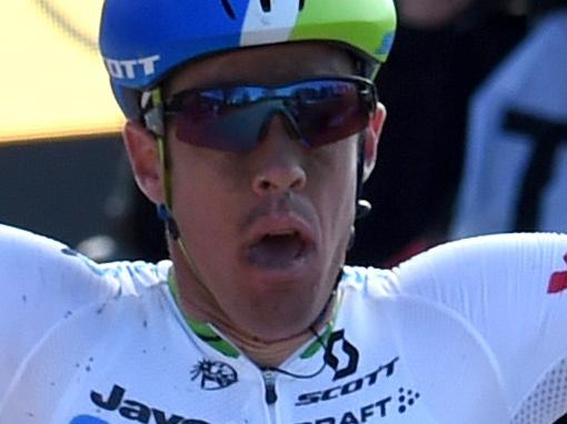 Australia's Mathew Hayman celebrates as he crosses the finish line and wins the 114th edition of the Paris-Roubaix one-day classic cycling race, between Compiegne and Roubaix, on April 10, 2016, in Roubaix, northern France. AFP PHOTO / FRANCOIS LO PRESTI