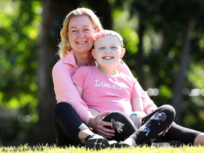 Sophie Allen, 9, who has cancer with her great aunt Vicky Graham, who is raising money for her treatment via triathlon, Kippa-Ring. Photo: Liam Kidston.