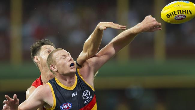 Callum Sinclair of the Swans and Sam Jacobs of the Crows contest a ball during the Round 2 match at the SCG in Sydney. Picture: AAP Image/Craig Golding