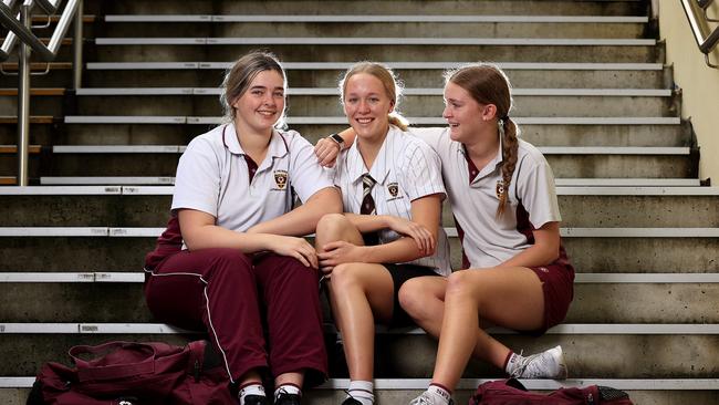 New Australian swimming star Ella Ramsay, middle, back school at St Peters Lutheran College with school friends Victoria Kuhn 17, and Ella Kreutzer 16. Pics Adam Head