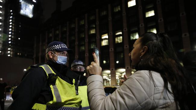 Met Police officers attempt to disperse crowds gathered near Westminster Bridge on January 1, 2021 in London. Picture: Getty