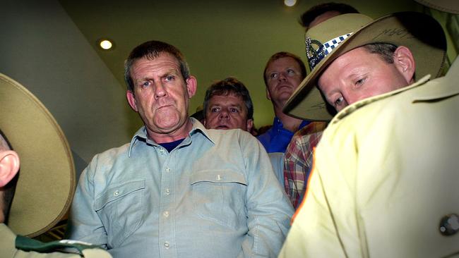 Bradley John Murdoch arrives under police escort at Darwin Airport to face charges of murdering British backpacker Peter Falconio. Picture: Patrina Malone