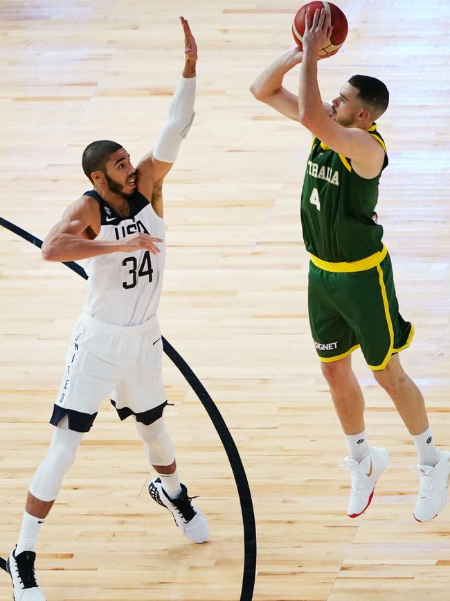 Chris Goulding shoots the ball past USA and Boston Celtics star Jayson Tatum at Marvel Stadium. Picture: AAP