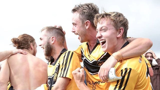 Jubilant Tea Tree Gully players celebrate their shock win over West Adelaide in the FFA Cup SA. Photo: Adam Butler