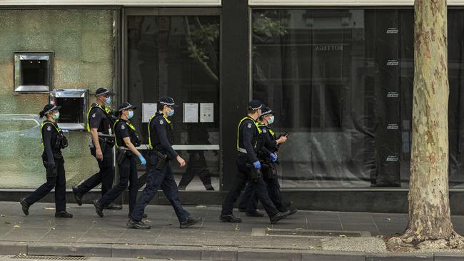 Victorian Police patrol the Melbourne CBD. Picture: NCA NewsWire / Daniel Pockett