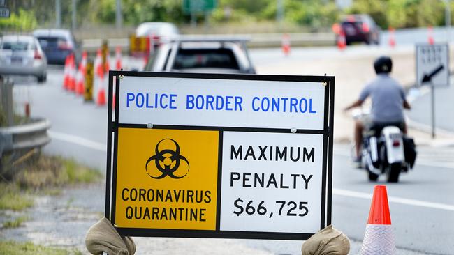 Border control signage on the Queensland - New South Wales border. Picture: AAP Image/Dave Hunt