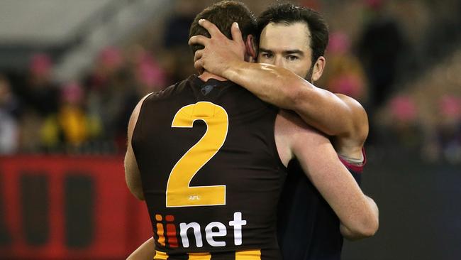 Jarryd Roughead and Jordan Lewis embrace after the game. Picture: Wayne Ludbey