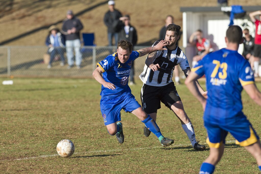 Ashley Freier (left) of USQ FC and Nathan Daly of Willowburn in Toowoomba Football League Premier Men semi-final at Commonwealth Oval, Sunday, August 26, 2018. Picture: Kevin Farmer