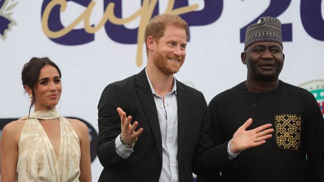 Prince Harry is big on charity work. Here he poses for a photo after a charity polo game at the Ikoyi Polo Club in Lagos on May 12. Picture: Kola Sulaimon / AFP