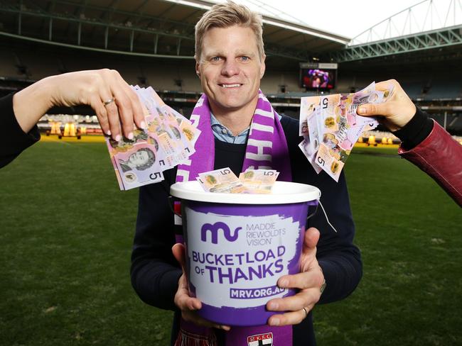 Nick Riewoldt holds a collection bucket for Maddie’s Match. Picture: Michael Klein