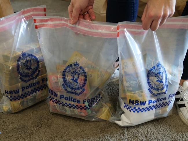 More than $640,000 in cash was allegedly found stashed throughout the Merrylands unit. Picture: NSW Police