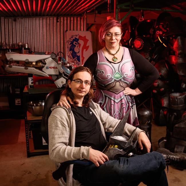 Clare "Henchwench" McCutcheon and Oarin "Scrap Shop Props" Tremont with some of their Overwatch creations — Zarya’s particle cannon, and Reinhardt’s helmet, hammer and armour. Picture: Matt Turner