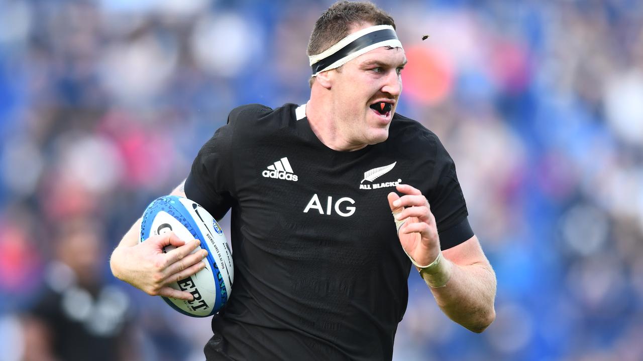 Brodie Retallick of New Zealand runs to score a try.